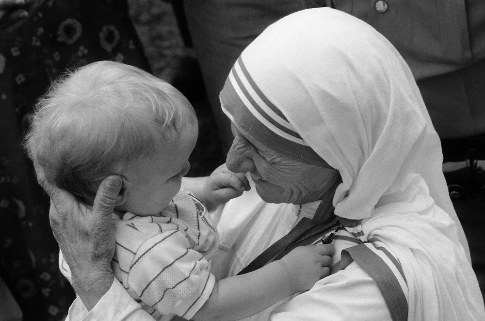 Mother Teresa with child in Jenkins